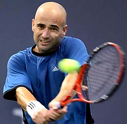 Andre Agassi of the USA hits a backhand during his match against Jean-Rene Lisnard of France in the first round of the Mercedes Benz Cup