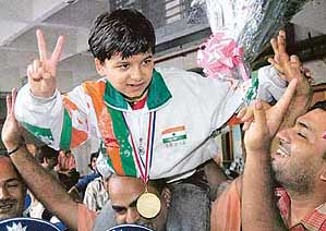 Sahaj Grover, who became the youngest Indian to win the World Youth Chess Championship at Belfort, is welcomed on his arrival at Indira Gandhi International Airport in New Delhi on Saturday.