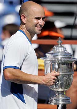 Andre Agassi of the USA poses with the trophy after defeating Gilles Muller of Luxembourg in the final of the Mercedes Benz Cup in Los Angeles on Sunday
