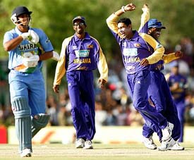 Sri Lanka�s Tillakaratne Dilshan (left) celebrates with Mahela Jayawardene after dismissing Suresh Raina during their tri-series one-day international against India at Dambulla on Wednesday. 