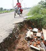 A deep pit along the road dividing Sectors 48 and 49 in Chandigarh which needs immediate attention.