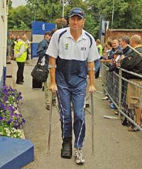 Australian bowler Glenn McGrath arrives on crutches to watch the second day�s play of the second Test at Edgbaston in Birmingham