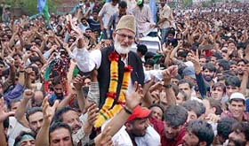 Kashmiri leader Syed Ali Shah Geelani is held on the shoulders by supporters of the Tehreek -e-Hurriyat at a public rally in Srinagar on Sunday.