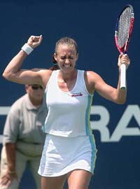 Mary Pierce of France reacts after winning a point