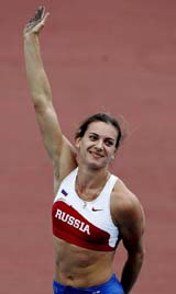 Yelena Isinbayeva of Russia waves to spectators after clearing a jump during the women�s pole vault event at the World Athletics Championships in Helsinki on Sunday