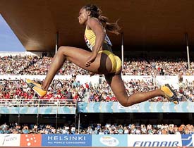 Jamaica�s Trecia Smith competes in the triple jump event at the World Athletics Championships in Helsinki on Sunday. Trecia won the gold medal with a leap of 15.11 metres