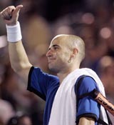 Andre Agassi of the USA gives the thumbs up sign after winning his first round match against Alberto Martin of Spain at the Rogers Cup in Montreal