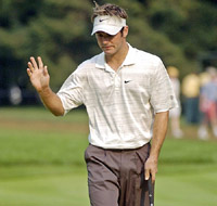 Trevor Immelman of South Africa gestures after a birdie putt on the 12th hole at the 2005 PGA Championship at Baltusrol Golf Club in Springfield