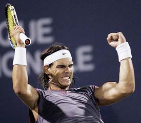 Spain's Rafael Nadal celebrates after beating France's Paul-Henri Mathieu