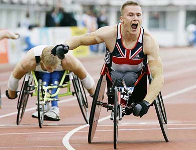Britain's David Weir reacts after crossing the line to win the 200 metres wheelchair race at the World Athletics Championships in Helsinki on Sunday