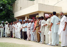 Consumers with electricity bills stand in a queue at the PSEB office on the Power House road in Bathinda on Wednesday.