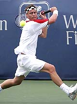 Australia�s Lleyton Hewitt hits a backhand shot during his match against Russia�s Igor Andreev in the first round of the Cincinnati Masters in Mason