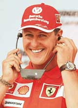 Ferrari Formula One driver Michael Schumacher takes off his earphone during a press conference in Istanbul on Thursday
