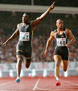 World champion Justin Gatlin of the USA celebrates on winning the men�s 100 metres race at the Zurich Golden League meeting in Switzerland on Friday. Gatlin won in a time of 10.14 seconds while compatriot Maurice Greene (right) finished eighth. 
