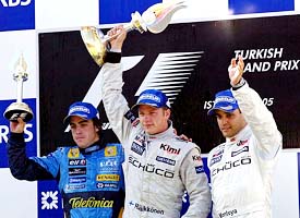 Turkish Grand Prix winner Kimi Raikkonen with runner-up Fernando Alonso and third-placed Juan Pablo Montoya at the Formula One race track in Istanbul