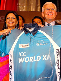 ICC Chief Executive Officer Malcolm Speed and TV personality Mandira Bedi hold the Super Series World XI T-shirt