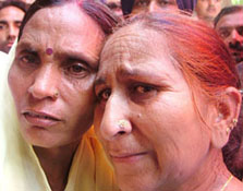 Ms Dalbir Kaur, sister of Sarabjit Singh, on her return from New Delhi after meeting senior leaders, is being received by Sukhpreet Kaur at their home in Bhikhiwind on Thursday
