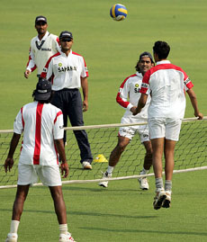 Members of the Indian cricket team play a ball game during a practice session at the Harare Sports Club on Sunday. India take on hosts Zimbabwe in a tri-series match on Monday.