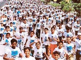 Children participate in the Rajiv Gandhi Marathon organised by the National Sports Club in New Delhi on Sunday.
