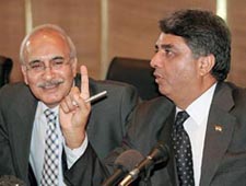 Home Secretary Vinod Kumar Duggal (right) gestures as Pakistan’s Interior Secretary Syed Kamal Shah smiles during their Press conference in New Delhi on Tuesday.