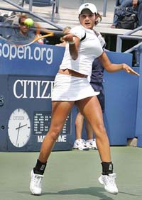 Sania Mirza hits a forehand return during her match against Mashona Washington of the USA in the first round of the US Open at Flushing Meadows in New York on Monday. 