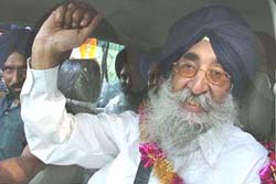 Simranjit Singh Mann waives to the crowd after being released from the Ludhiana Central Jail on Wednesday. 