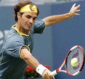 Roger Federer of Switzerland makes a return to Ivo Minar of the Czech Republic