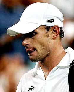 Andy Roddick of the US walks off the court after losing to Gilles Muller of Luxembourg 