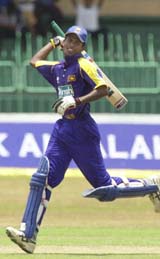 Upul Tharanga of Sri Lanka celebrates on completing his maiden century during the one-day match against Bangladesh in Colombo