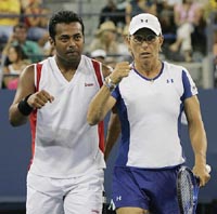 Mixed doubles partners Leander Paes and Martina Navratilova react after beating Virginia Ruano Pascual and Stephen Huss 