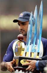 Sri Lankan captain Marvan Atapattu holds the trophy after defeating Bangladesh by six wickets in the third and final match of their one-day series in Colombo