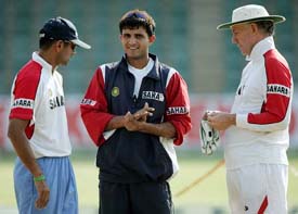 Indian captain Sourav Ganguly  with team-mate Rahul Dravid and coach Greg Chappell during a practice session at the Harare Sports Club on Monday