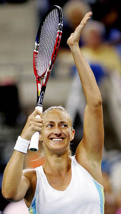 Mary Pierce of France rejoices after defeating Justine Henin-Hardenne of Belgium in their fourth-round match at the US Open in New York 