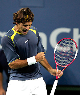 Roger Federer of Switzerland celebrates a point against David Nalbandian of Argentina 