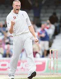 Andrew Flintoff of England exults after dismissing Damien Martyn of Australia