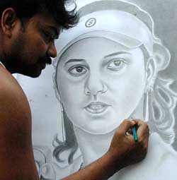 An artist gives finishing touches to a pencil sketch of tennis star Sania Mirza in Kolkata on Monday