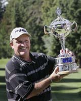 Mark Calcavecchia of the USA holds the trophy after winning the Canadian Open golf tournament in Vancouver, British Columbia