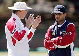 India�s cricket coach Greg Chappell talks to captain Sourav Ganguly during a practice session at the Queen�s Sports Club in Bulawayo on Monday