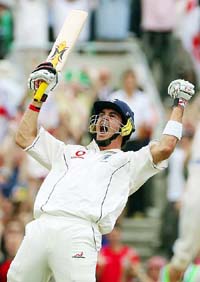 England�s Kevin Pietersen celebrates on completing his century against Australia on the final day of the fifth Ashes Test at the Oval in London on Monday