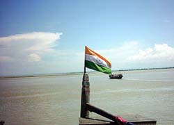 The Tricolour flutters on a boat after the Indian authorities in a bid to check Bangladeshi boats in Indian waters, made it mandatory for Indian boatmen to put the National Flag on their boats in Dhubri district of Assam near the India-Bangladesh border on Tuesday.