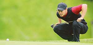 South Africa�s Trevor Immelman lines up a putt on the first green on the first day of the World Match Play Championship at Wentworth in southern England on Thursday