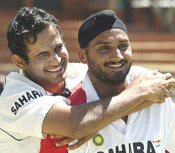 Irfan Pathan, who was adjudged the man of the match, and spinner Harbhajan Singh are all smiles at the awards ceremony after India defeated Zimbabwe by an innings and 90 runs in the first Test match in Bulawayo on Friday.