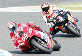 Italian 500cc Grand Prix rider Loris Capirossi  leads countryman Max Biaggi to win the Japanese Grand Prix at the Twin Ring Motegi circuit, near Tokyo on Sunday