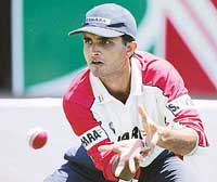 Sourav Ganguly catches the ball during a practice session at the Harare Sports Club on Monday
