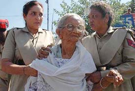 Kanshi Ram�s 96-year-old mother Bishen Kaur is led to a police vehicle after she courted arrest in Ludhiana on Tuesday to protest against the �illegal custody� of her son with Mayawati.