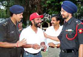 Army officers welcome Major DP Singh on his arrival in Bathinda on Tuesday.