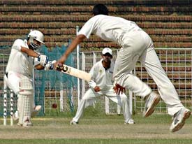 Ankur Kakkar (left) of Punjab Cricket Club plays a shot during their semifinal match against Bishnoi Club in the J.P. Atray Cricket Tournament at the Sector 16 Stadium in Chandigarh on Wednesday.