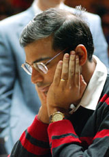 India's Vishwanathan Anand studies the board against Vaselin Topalov of Bulgaria