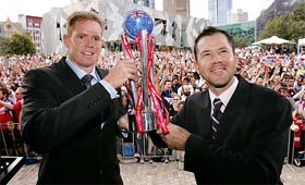 Shaun Pollock, captain of ICC World XI, and Australian captain Ricky Ponting hold the Super Series trophy in Melbourne