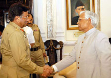 Pakistan President Pervez Musharraf shakes hands with Foreign Minister Natwar Singh in Rawalpindi on Tuesday